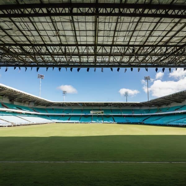 Stadium view with empty seats and bright sky, ideal for sports news coverage.