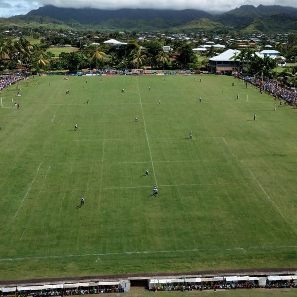 Aerial view of a soccer game in progress at a local stadium in Fiji.