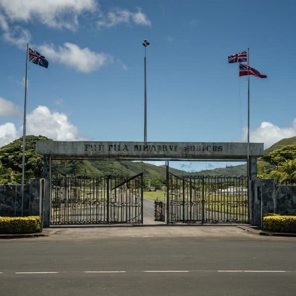 Fiji Fijian Military Academy entrance with flags and gates.