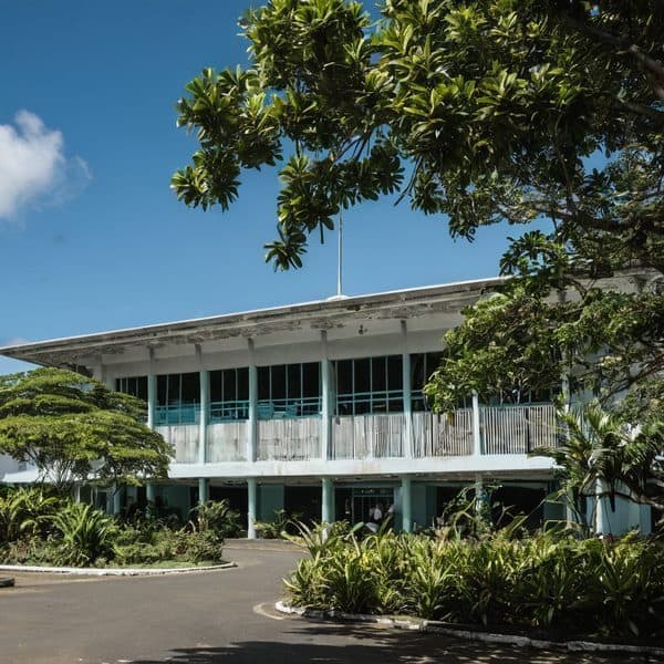 Modern office building surrounded by lush greenery in Fiji.