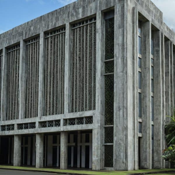 Fiji government building with modern concrete architecture and vertical window design.
