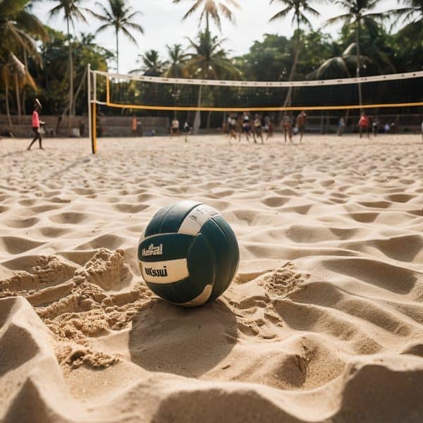 Beach volleyball on sandy shore with players and palm trees in background.
